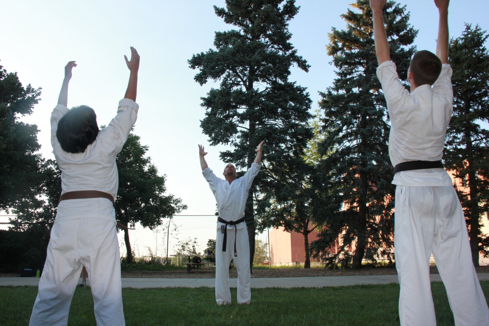 three members of Shotokan Karate work as the sun goes down 